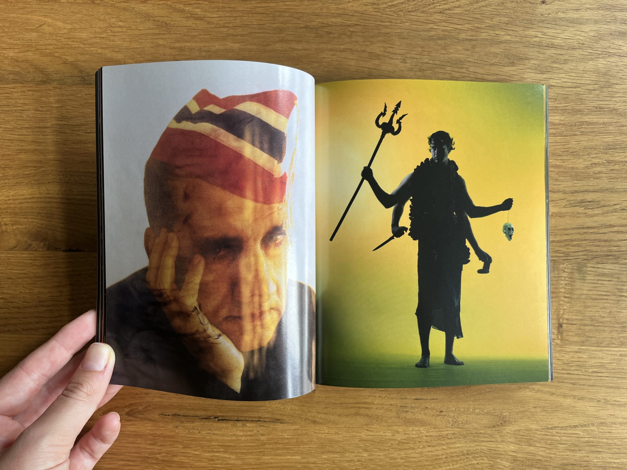 Open spread from Mixed: a close-up portrait of a person in a striped head covering faces a silhouetted multi-armed figure holding a trident.