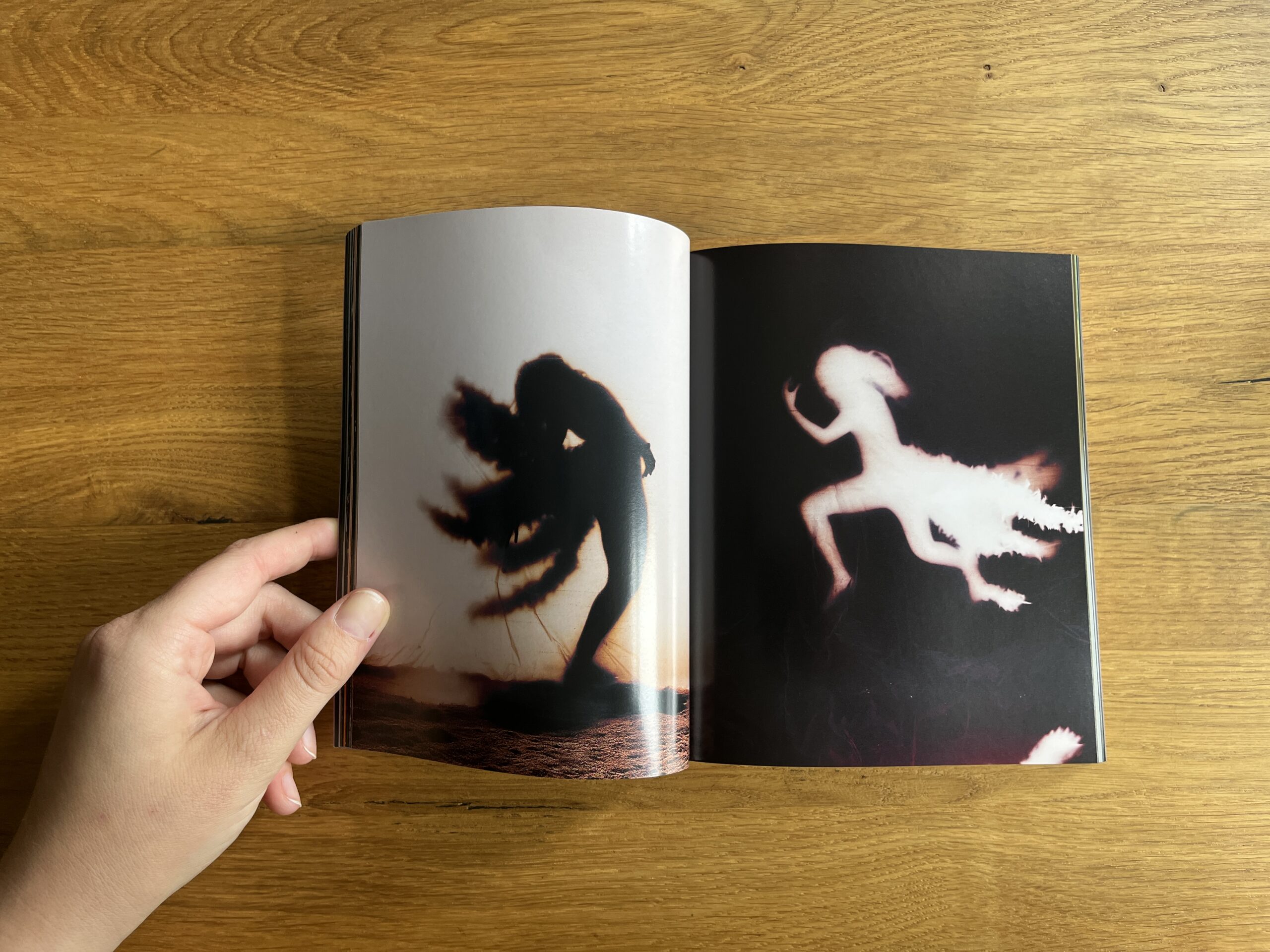 Open spread from Mixed with two blurred, ghostly figures in motion against bright (left) and dark (right) backgrounds.