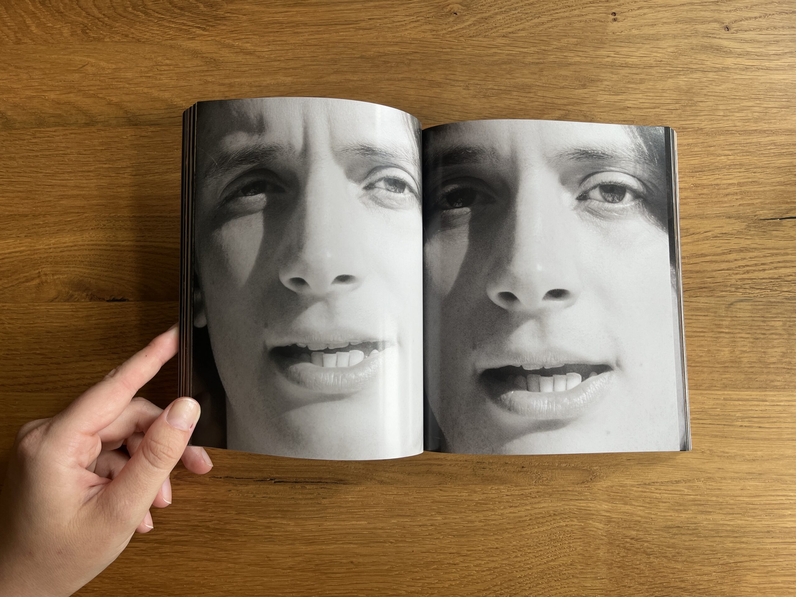 Open spread from Mixed showing a black-and-white close-up portrait split across two pages.