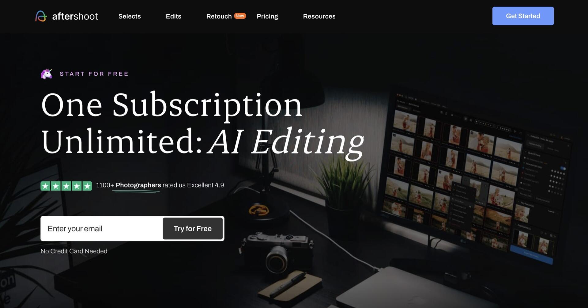 A dark-themed workspace with a computer displaying photo thumbnails, a camera, lens, and coffee cup on the desk. Text reads “One Subscription Unlimited: AI Editing” with options to start a free trial.