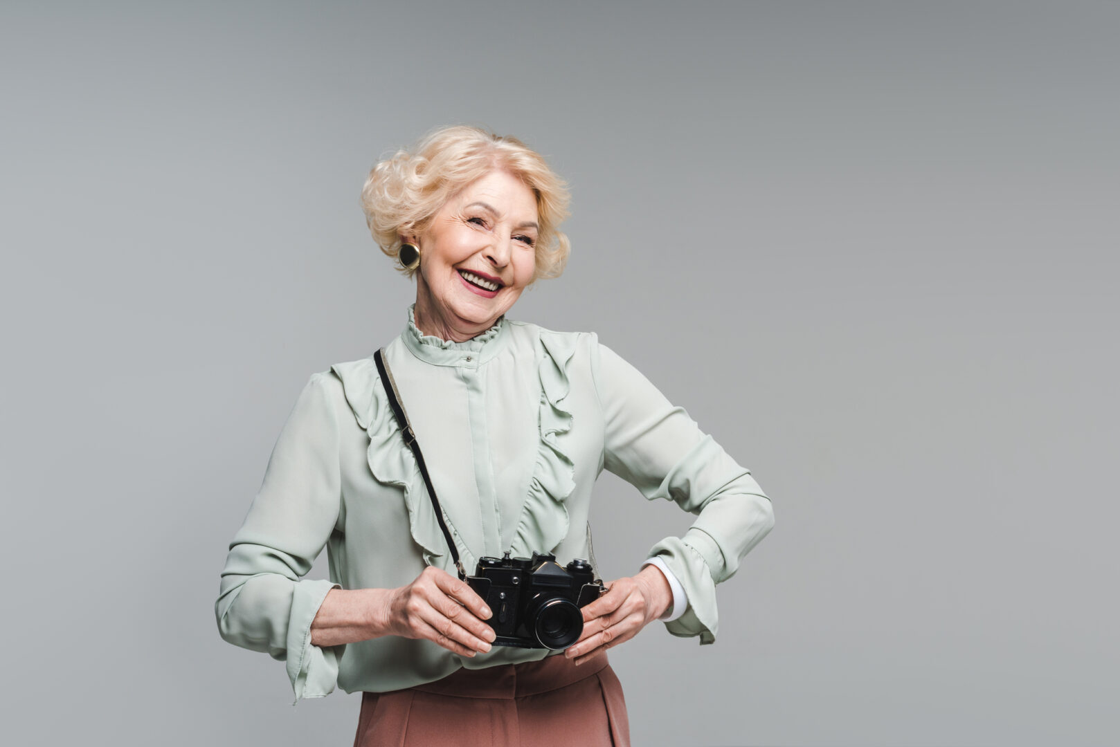 Elderly person with a camera