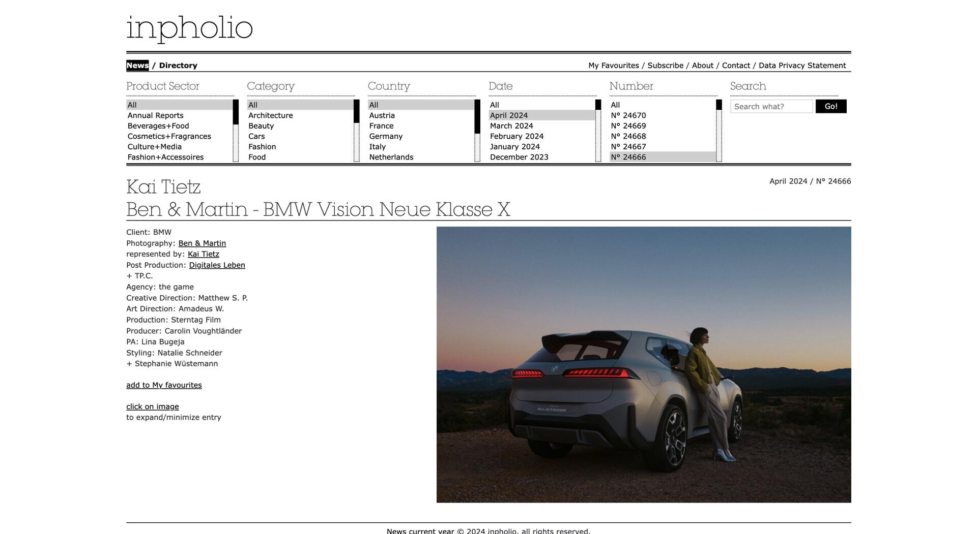 A person stands beside a silver BMW Vision Neue Klasse X SUV at sunset, overlooking a scenic landscape with mountains under a clear sky. The scene appears serene and picturesque.