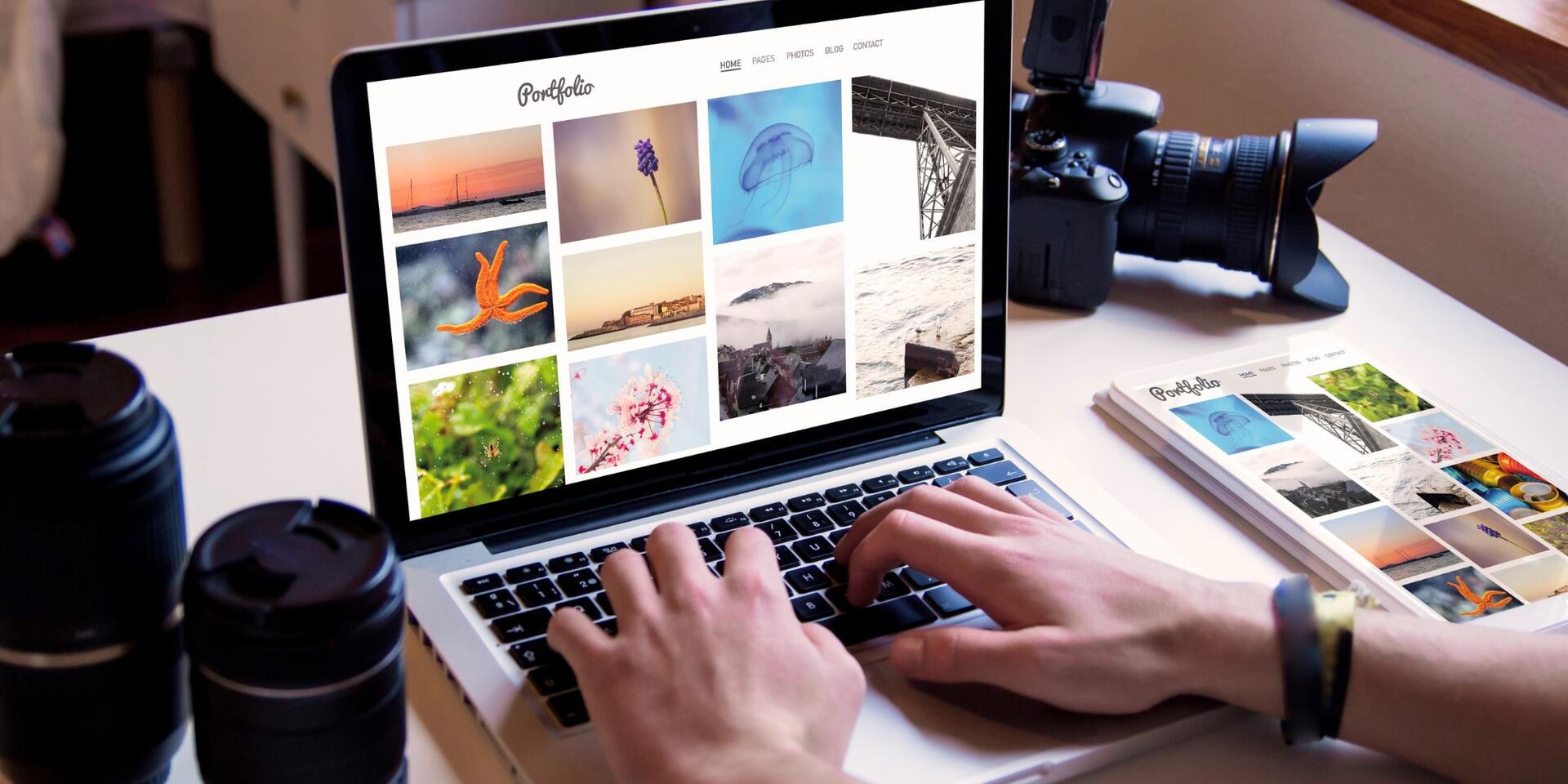 A person browses a photography portfolio on a laptop at a desk, with camera lenses, a camera, and a magazine nearby. The laptop screen displays a grid of colorful photos.