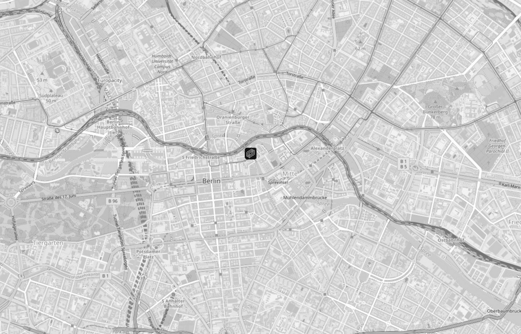 Black and white map of central Berlin showing streets, rivers, and parks, with a highlighted square near the River Spree indicating a specific location close to Berlin Mitte.